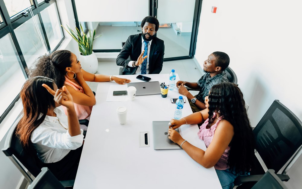 A team in discussion around a meeting table